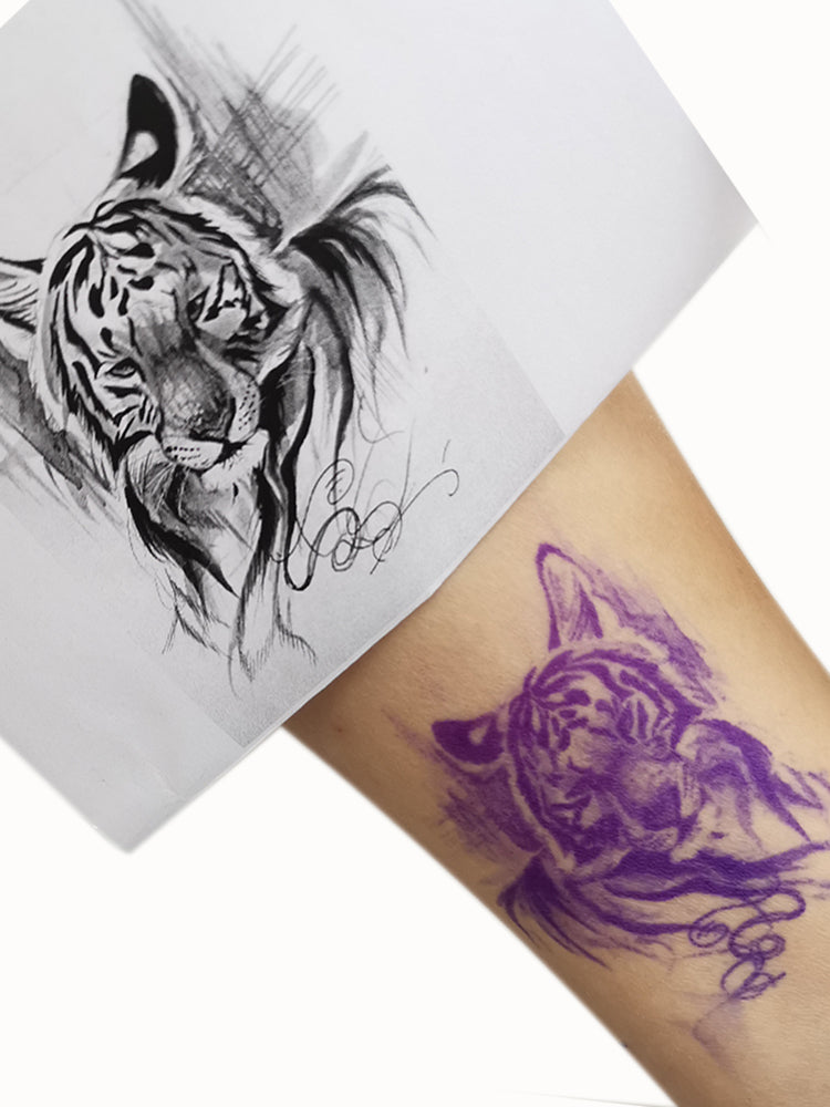 Printed design vs. purple stencil on skin